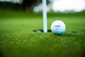 close up image of golf ball on green grass